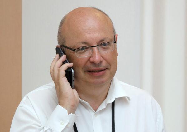 Jean-Pierre Thebault, then French ambassador in charge of G-7 summit preparations, speaks on his mobile phone while working in Biarritz, France, on Aug. 25, 2019. (Ludovic Marin/AFP via Getty Images)