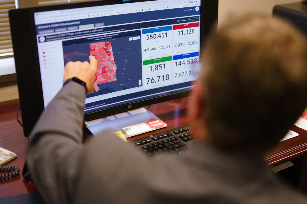 Dr. Scott Harris, Alabama's state health officer, points at a computer screen in his office in Montgomery, Ala., on June 29, 2021. (Elijah Nouvelage/AFP via Getty Images)