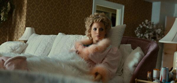 Jessica Chastain as Tammy Faye Bakker in the lap of luxury. (Searchlight Pictures. Twentieth Century Studios)