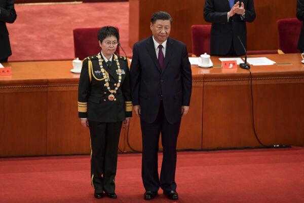 Major General Chen Wei (L) receives an award from Chinese leader Xi Jinping in Beijing on Sept. 8, 2020. (Nicolas Asfouri/AFP via Getty Images)