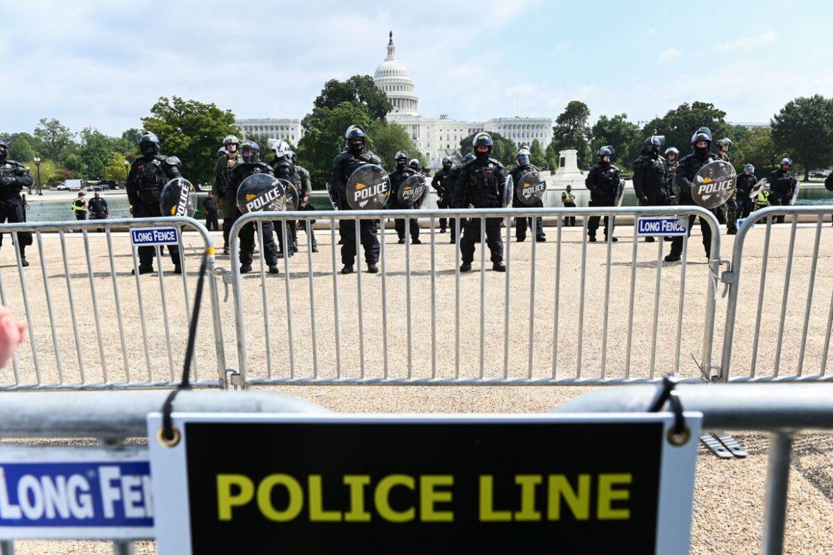 Police in riot gear provide security as demonstrators gather for the "Justice for J6" rally in Washington on Sept. 18, 2021. (Roberto Schmidt/AFP via Getty Images)