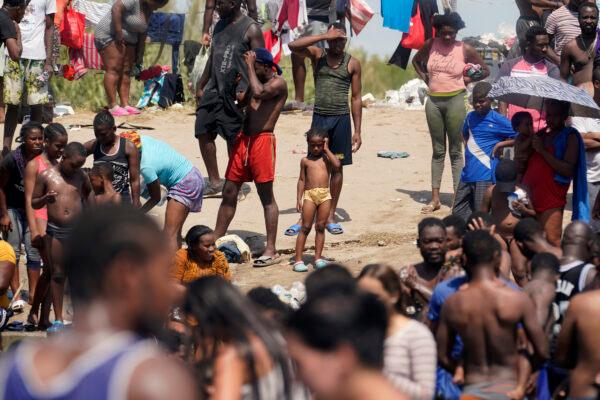 Haitian migrants gather on the banks of the Rio Grande after they crossed into the United States from Mexico, in Del Rio, Texas, on Sept. 18, 2021. (Eric Gay/AP Photo)