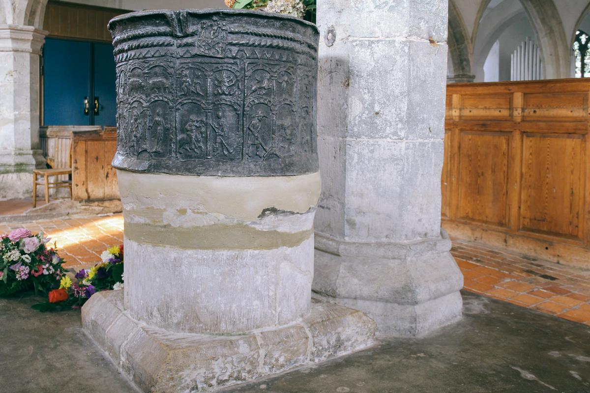 The circular lead baptismal font inside St. Augustine’s Church in Brookland, England, has been used for religious rites since the early 13th century. (Dennis Lennox)