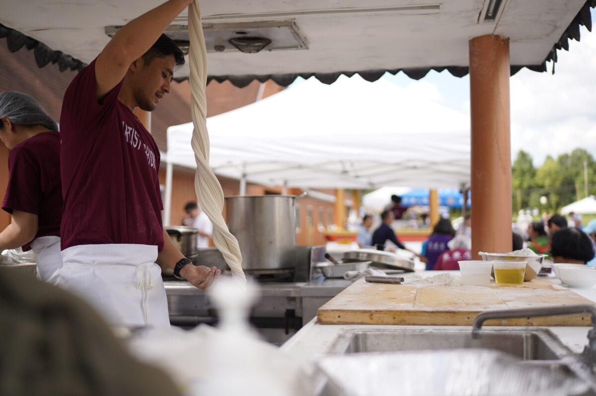 Chef making noodles during Mid-Autumn festival in New Century Film, at Port Jervis, New York, on Sep 18, 2021. (Enrico Trigoso/The Epoch Times)