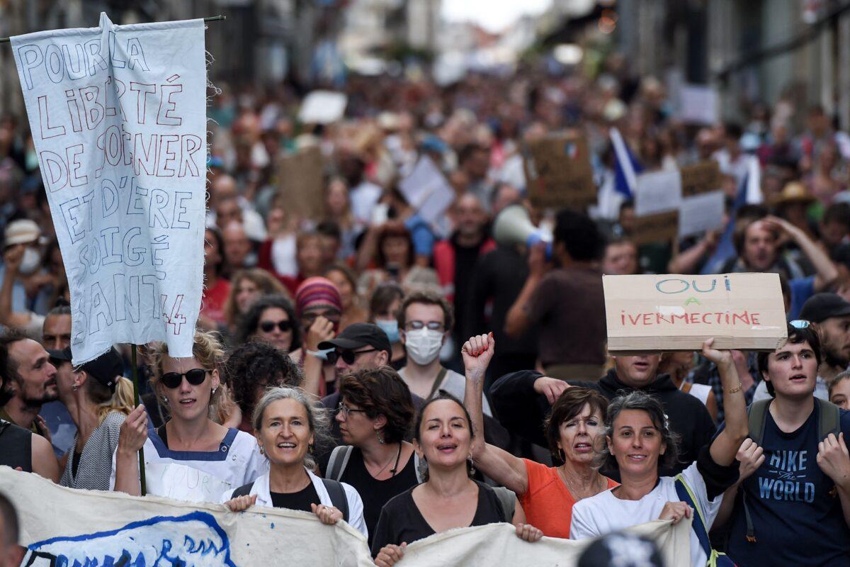 Demonstrators hold placards and chant slogans as they march during a rally in Nantes, western France, on Sept. 18, 2021. (Sebastien Salom-gomis/AFP via Getty Images)