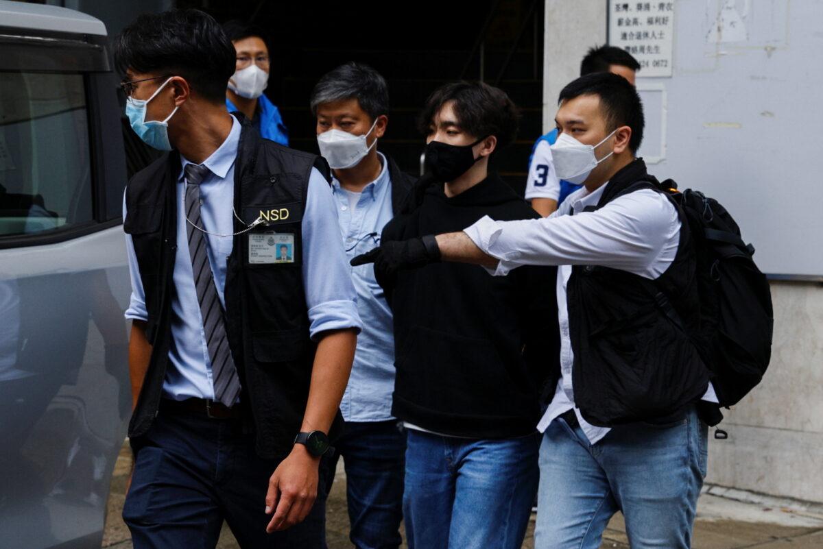 Convenor of Student Politicism Wong Yat-chin is detained by police, in Hong Kong, on Sept. 20, 2021. (Tyrone Siu/Reuters)