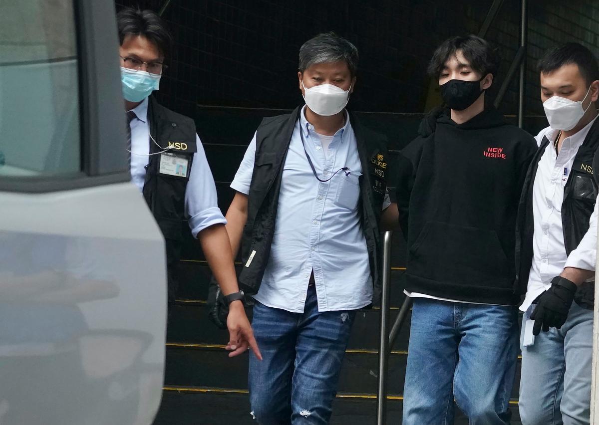 Wong Yat-chin (2nd R), leader of Student Politicism is arrested by "national security" police in Hong Kong on Monday, Sept. 20, 2021. (AP Photo)