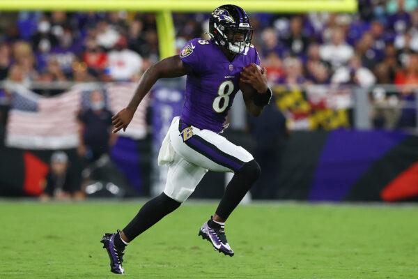 Lamar Jackson #8 of the Baltimore Ravens scrambles with the ball against the Kansas City Chiefs during the second quarter at M& T Bank Stadium, in Baltimore, Md., on Sept. 19, 2021. (Todd Olszewski/Getty Images)