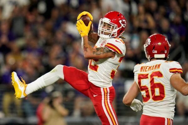 Kansas City Chiefs free safety Tyrann Mathieu (L) intercepts a pass attempt in front of teammate Ben Niemann in the first half of an NFL football game against the Baltimore Ravens, in Baltimore, Md., on Sept. 19, 2021. (Julio Cortez/AP Photo)