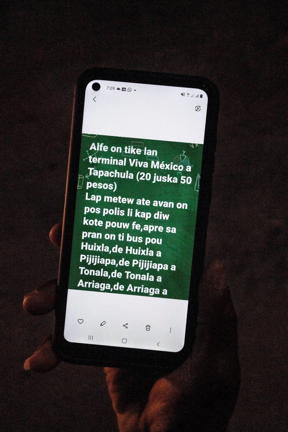 A migrant seeking asylum in the U.S. shows his smartphone with instructions on how to get to the U.S., in Ciudad Acuna, Mexico, on Sept. 17, 2021. (Go Nakamura/Reuters)