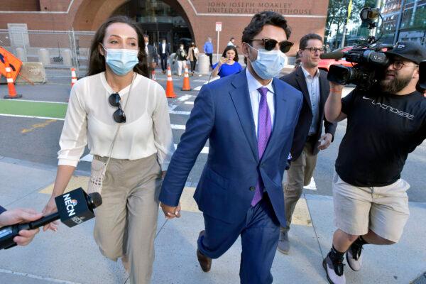 Former Fall River, Mass. Mayor Jasiel Correia and his wife Jenny Fernandes, left, leave a court appearance at the John Joseph Moakley United States Courthouse, in Boston, on Sept. 20, 2021. (Josh Reynolds/AP Photo)