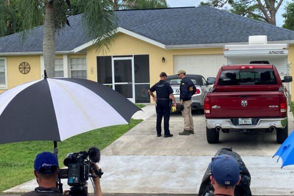 Law enforcement officials investigate the home of Brian Laundrie, who is wanted for questioning in the disappearance of his girlfriend, Gabby Petito, in North Port, Fla., on Sept. 20, 2021. (Curt Anderson/AP Photo)