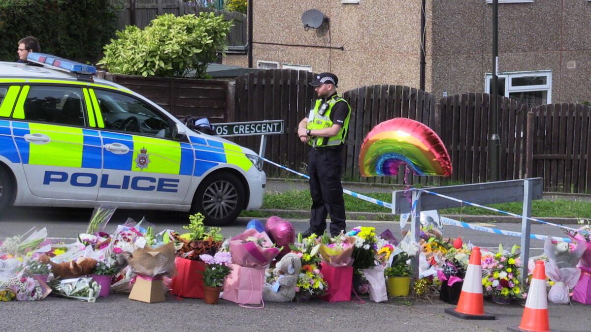 Flowers near to the scene where the bodies of John Paul Bennett, 13, Lacey Bennett, 11, their mother Terri Harris, 35, and Lacey’s friend Connie Gent, 11, were discovered at a property on Sunday morning, in Chandos Crescent, Killamarsh, near Sheffield, England, on Sept. 21, 2021. (Dave Higgens/PA)
