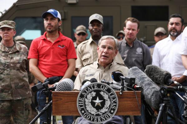 Texas Gov. Greg Abbott holds a press conference about the thousands of illegal immigrants, mostly Haitians, living in a primitive, makeshift camp under the international bridge that spans the Rio Grande between the United States and Mexico while waiting to be detained and processed by Border Patrol, in Del Rio, Texas, on Sept. 21, 2021. (Charlotte Cuthbertson/The Epoch Times)