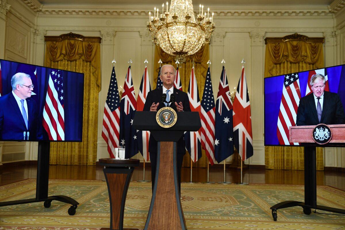 U.S. President Joe Biden participates in a virtual press conference on national security with British Prime Minister Boris Johnson (R) and Australian Prime Minister Scott Morrison at the White House in Washington on Sept. 15, 2021. The three leaders announced the AUKUS defense partnership between their countries. (Brendan Smialkowski/AFP via Getty Images)