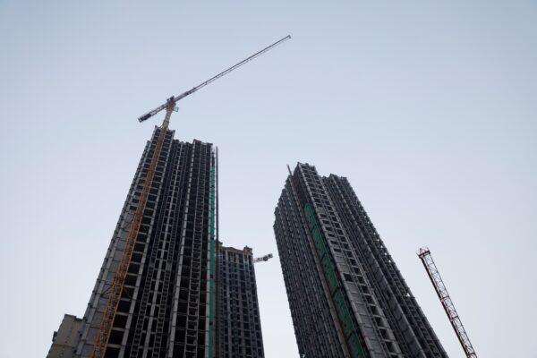 Cranes stand next to unfinished residential buildings at the Evergrande Oasis, a housing complex developed by Evergrande Group, in Luoyang, China on September 15, 2021. (Carlos Garcia Rawlins/Reuters)
