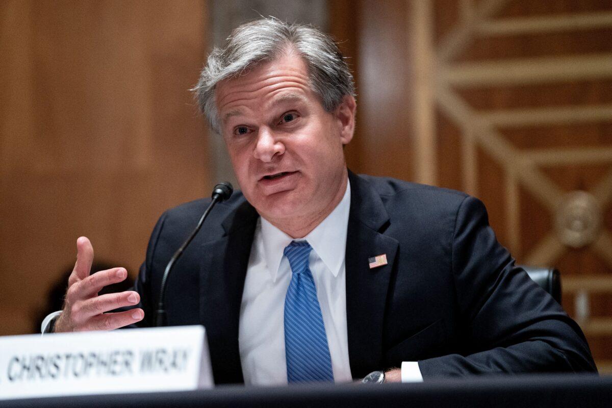 FBI Director Christopher Wray testifies during a hearing to discuss security threats 20 years after the 9/11 terrorist attacks, at the US Capitol in Washington, on Sept. 21, 2021. (Greg Nash/ POOL/AFP via Getty Images)