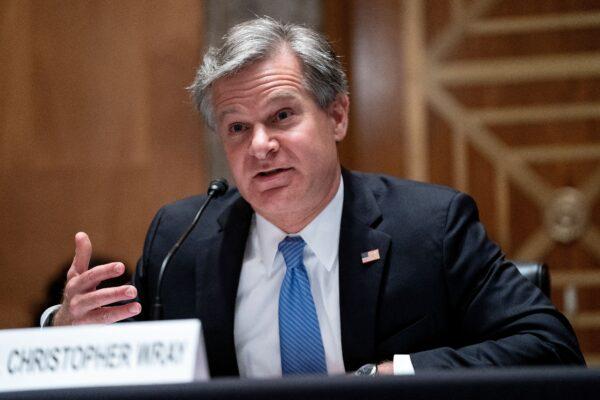 FBI Director Christopher Wray testifies during a hearing to discuss security threats 20 years after the 9/11 terrorist attacks, at the U.S. Capitol in Washington, on Sept. 21, 2021. (Greg Nash / POOL / AFP via Getty Images)