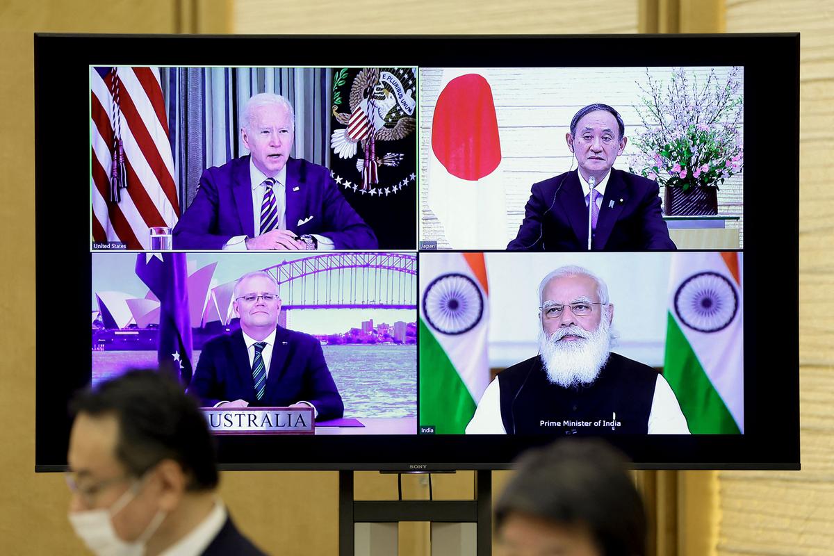 A monitor displaying a virtual meeting with U.S. President Joe Biden (top L), Australia's Prime Minister Scott Morrison (bottom L), Japan's Prime Minister Yoshihide Suga (top R), and India's Prime Minister Narendra Modi is seen during the virtual Quadrilateral Security Dialogue (Quad) meeting, at Suga's official residence in Tokyo on March 12, 2021. (Kiyoshi Ota / POOL / AFP)