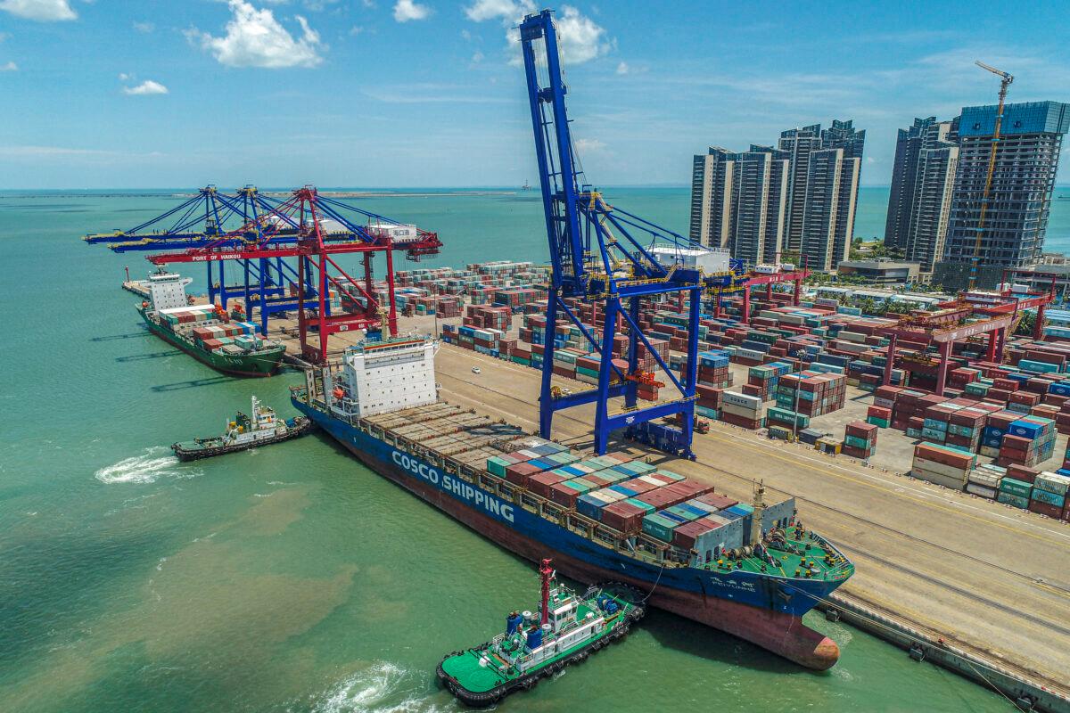 A cargo ship loaded with containers berthing at a port in Haikou in China's southern Hainan province on May 17, 2021. (STR/AFP via Getty Images)