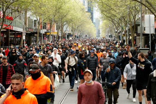 Protesters walk down Swanston Street in the Melbourne CBD, Australia, on Sept. 22, 2021. (Darrian Traynor/Getty Images)