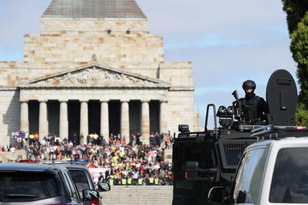 Protesters are seen at the Shrine of Remembrance as Victorian Police patrol the area in Melbourne, Australia, on Sept. 22, 2021. (Asanka Ratnayake/Getty Images)