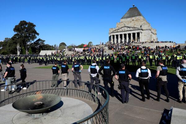 Protesters are seen at the Shrine of Remembrance as Victorian Police patrol the area in Melbourne, Australia, on Sept. 22, 2021. (Asanka Ratnayake/Getty Images)