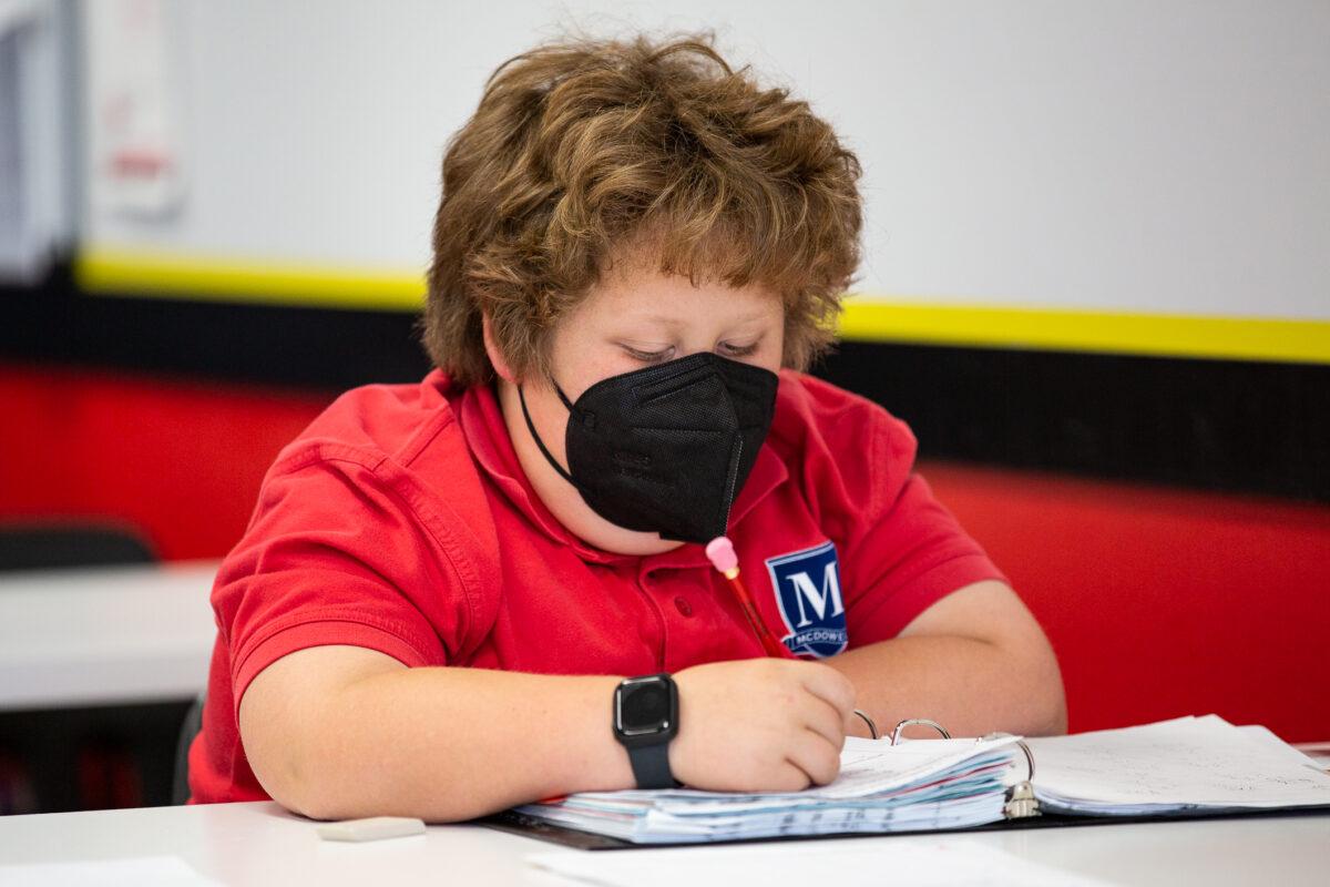 A student works on a math assignment at Mathnasium, in Laguna Niguel, Calif., on May 12, 2021.(John Fredricks/The Epoch Times)