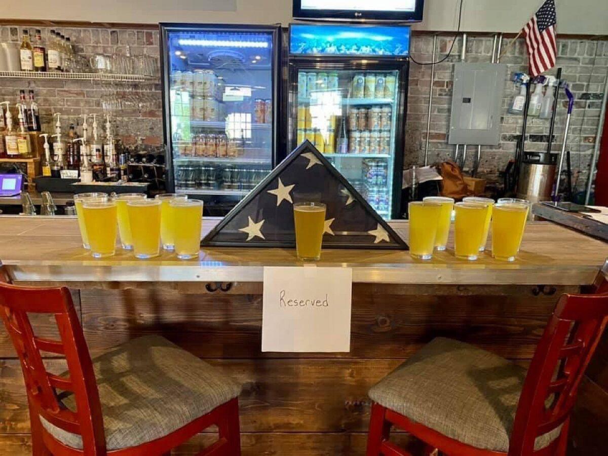 Tattered Flag Brewery in Dauphin County, Pennsylvania, set out 13 beers at the bar and marked the space “reserved” to honor the fallen service members. (Courtesy of Tattered Flag Brewery’s Facebook page)