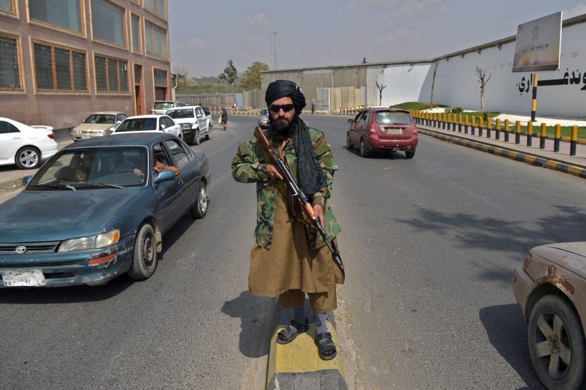 A Taliban fighter stands guard along a street near the Zanbaq Square in Kabul on Sept. 23, 2021. (Wakil Kohsar/AFP via Getty Images)