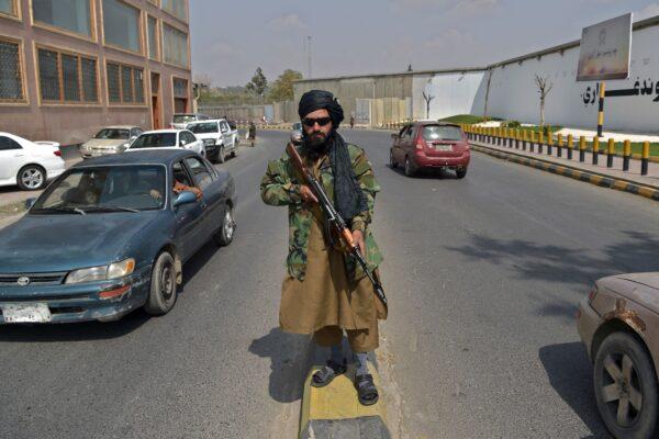 A Taliban terrorist stands guard along a street near Zanbaq Square in Kabul on Sept. 23, 2021. (Wakil Kohsar/AFP via Getty Images)