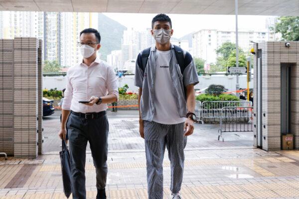 Pro-democracy activist Raymond Chan Chi-chuen and Owen Chow, two of the 47 pro-democracy activists charged with conspiracy to commit subversion under the national security law, arrive at the West Kowloon Magistrates's Courts building, in Hong Kong, on Sept. 23, 2021. (Tyrone Siu/Reuters)