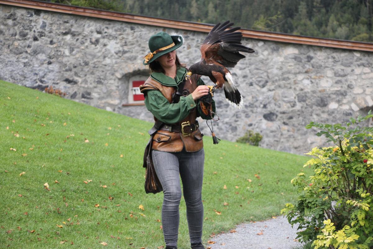A falconer with a bird of prey at Fortress Hohenwerfen. (Salzburg Burgen)
