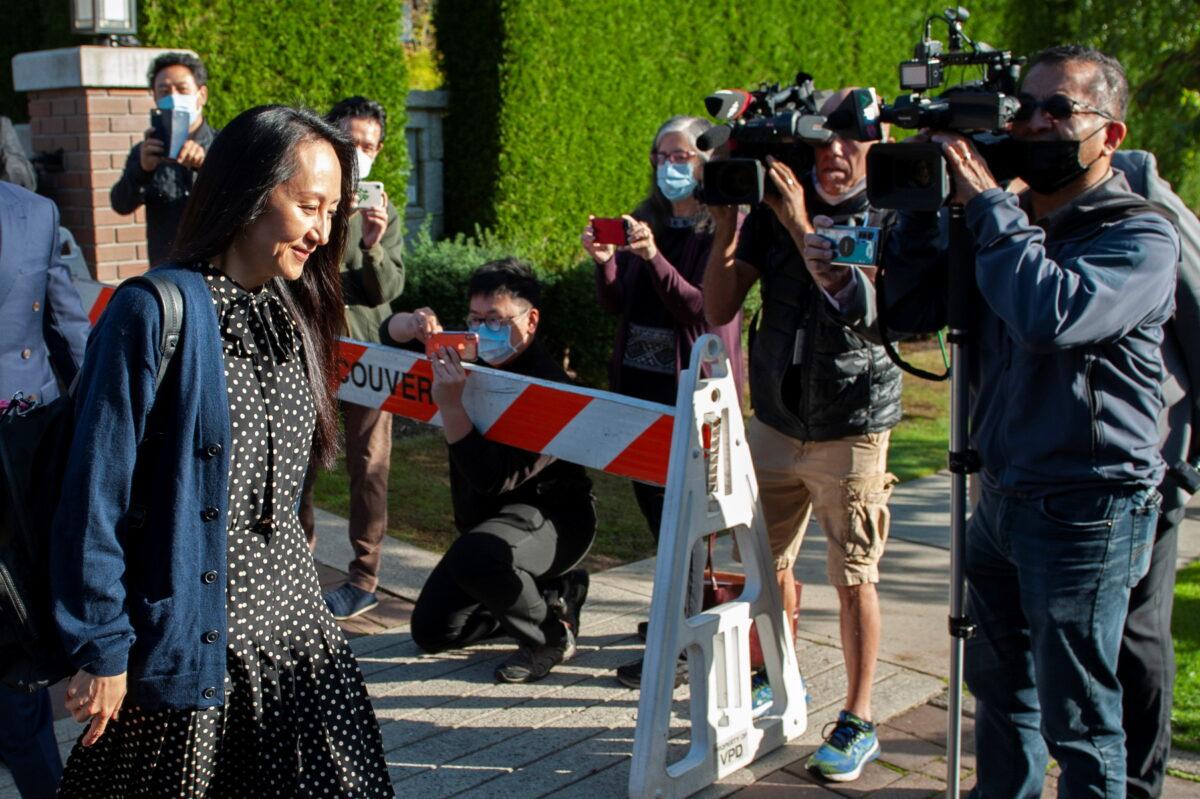 Huawei Technologies Chief Financial Officer Meng Wanzhou leaves her home to attend a virtual court hearing in Vancouver, British Columbia, Canada on Sept. 24, 2021. (Taehoon Kim/Reuters)
