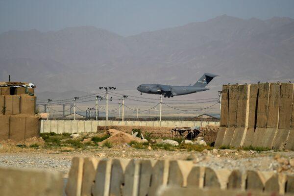 A US Air Force transport plane lands at the Bagram Air Base in Bagram on July 1, 2021. (Wakil Kohsar / AFP via Getty Images)