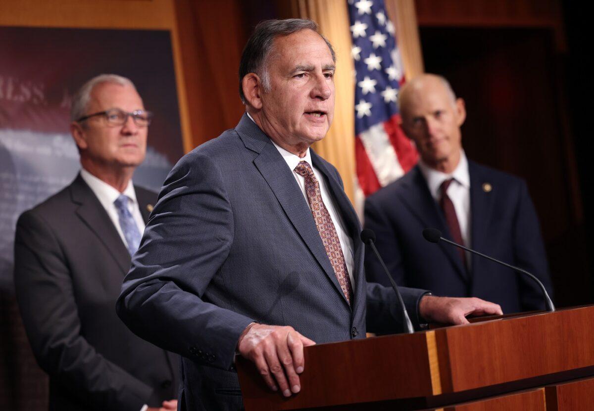 Sen. John Boozman (R-Ark.), joined by fellow Republican senators, speaks on a proposed Democratic tax plan, at the U.S. Capitol in Washington on Aug. 4, 2021. (Kevin Dietsch/Getty Images)
