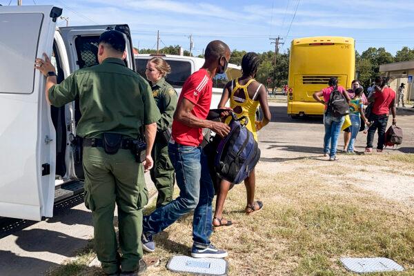Border Patrol drops van loads of Haitians who crossed the U.S. border illegally at local NGO Border Humanitarian Coalition to catch a bus to San Antonio or Houston, in Del Rio, Texas, on Sept. 22, 2021. (Charlotte Cuthbertson/The Epoch Times)