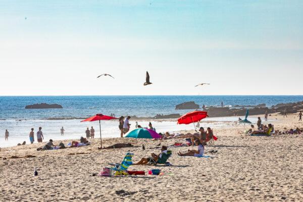 People partake in beachside activities in Laguna Beach, Calif., on October 15, 2020. (John Fredricks/The Epoch Times)
