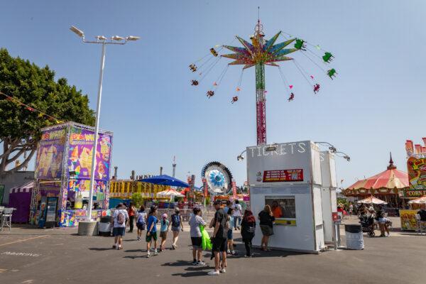 People enjoy the opening day of the Orange County Fair in Costa Mesa, Calif., on July 16, 2021. (John Fredricks/The Epoch Times)