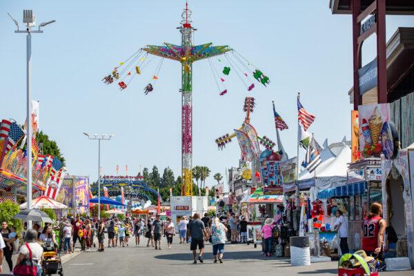 People enjoy opening day of the Orange County Fair in Costa Mesa, Calif., on July 16, 2021. (John Fredricks/The Epoch Times)