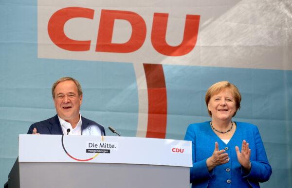 German Chancellor Angela Merkel and North Rhine-Westphalia State Premier, Christian Democratic Union (CDU) party leader and candidate for chancellor, Armin Laschet, attend a rally ahead of the Sept. 26 general election, in Aachen, Germany, on Sept. 25, 2021. (Wolfgang Rattay/Reuters)