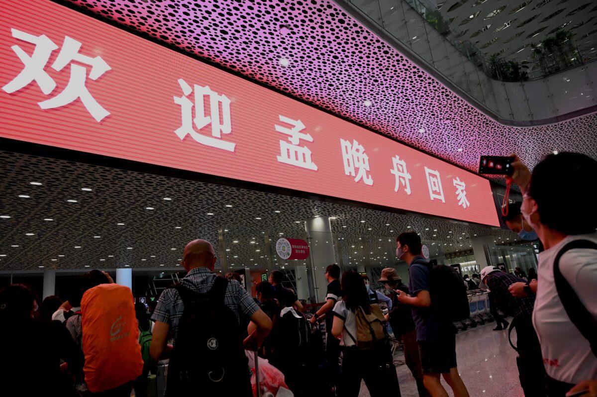 Characters that read "Welcome home Meng Wanzhou" are seen at the domestic arrivals area at the BaoAn International Airport in Shenzhen, southeastern China on Sept. 25, 2021, (NOEL CELIS/AFP via Getty Images)