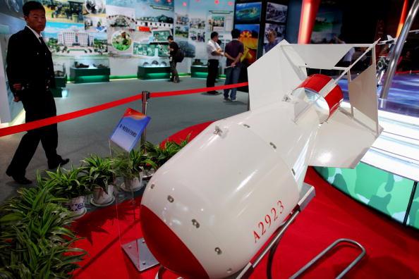 A man looks at an atomic bomb model at the 60th Anniversary Exhibition at the Beijing Exhibition Center, in Beijing, China, on Sept. 23, 2009. (Feng Li/Getty Images)