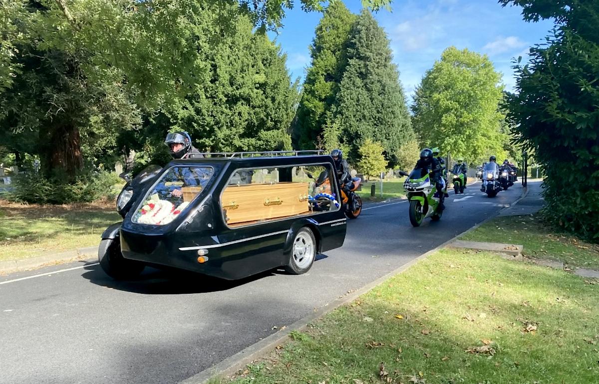 The father of two was carried to the funeral in a motorcycle sidecar hearse. (SWNS)