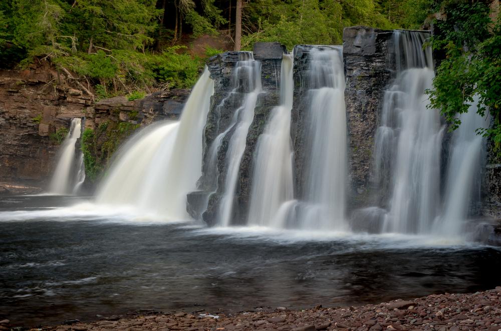 The Manabezho Falls, located in the Porcupine Mountains, are part of the Presque Isle River's spectacular final dash to Lake Superior. (Footsore Fotography/Shutterstock)