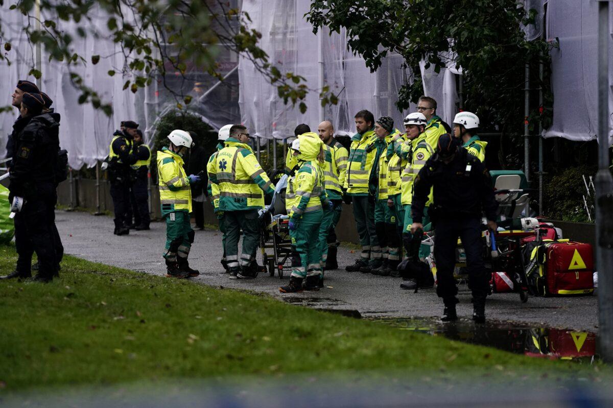 An emergency services crew works to evacuate people and put out fire after an explosion hit an apartment building in Annedal, central Gothenburg, Sweden, on Sept. 28, 2021. (Larsson Rosvall/TT News Agency via Reuters)