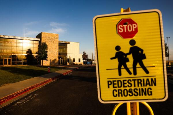 A crossing sign outside of Resurrection Christian School in Loveland, Colo., on Sept. 27, 2021. (Michael Ciaglo for The Epoch Times)