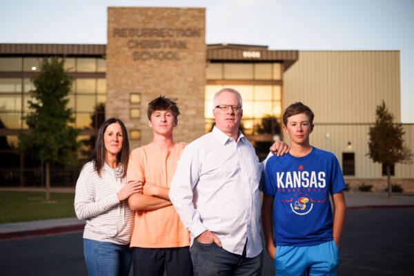 Karen Riggs and her husband, Mike Riggs, stand with their sons, Resurrection Christian School junior Charlie Riggs, 16 (2nd L), and freshman Graham Riggs, 13, outside the school in Loveland, Colo., on Sept. 27, 2021. (Michael Ciaglo for The Epoch Times)
