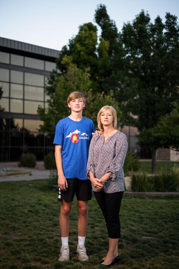 Resurrection Christian School sophomore Luke Sutter, 15, stands with his mother, Vicki Sutter, outside the school in Loveland, Colo., on Sept. 27, 2021. (Michael Ciaglo for The Epoch Times)