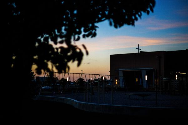 The sun sets behind the playground outside Resurrection Christian School in Loveland, Colo., on Sept. 27, 2021. (Michael Ciaglo for The Epoch Times)